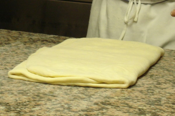 croissant dough folded into thirds.