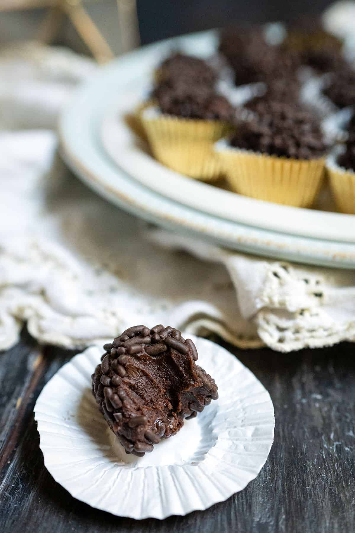 Bite taken out of chocolate truffle.