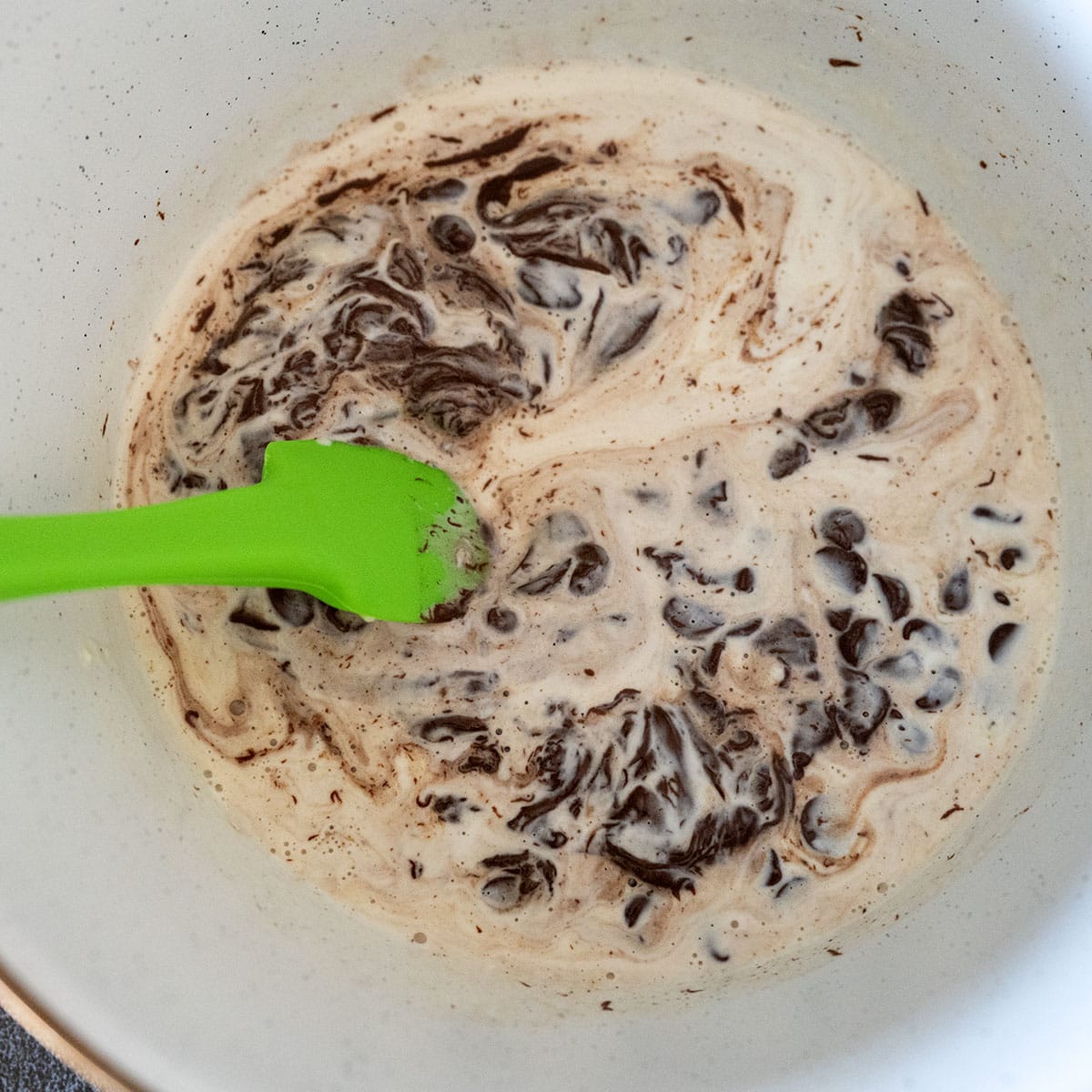 stirring melted chocolate.