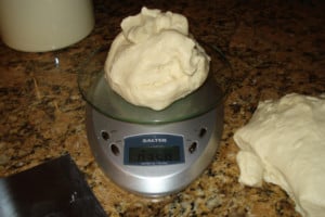 weighing baguette dough.