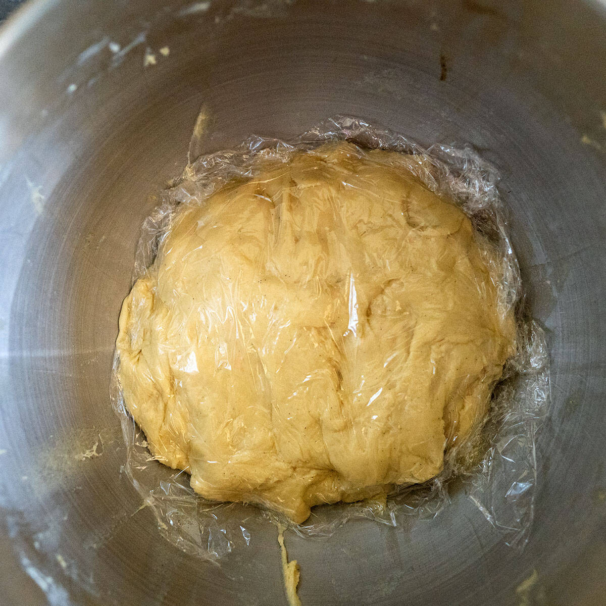 dough covered with plastic.