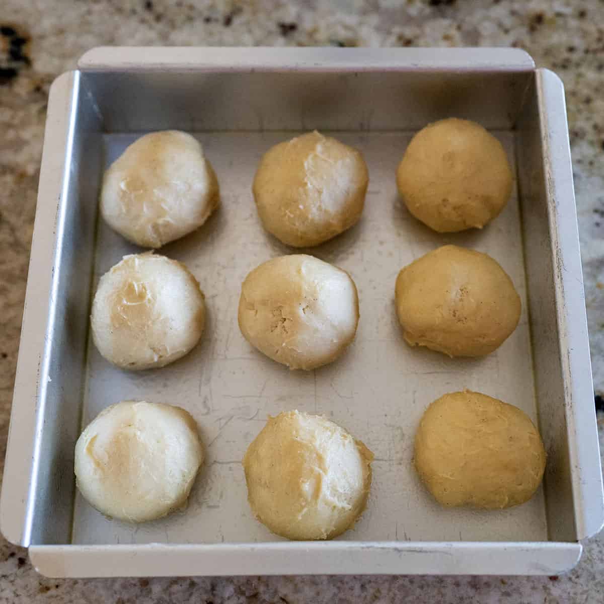 Dough balls in pan.