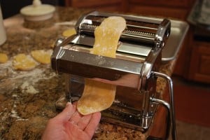 flattening fresh pasta dough.