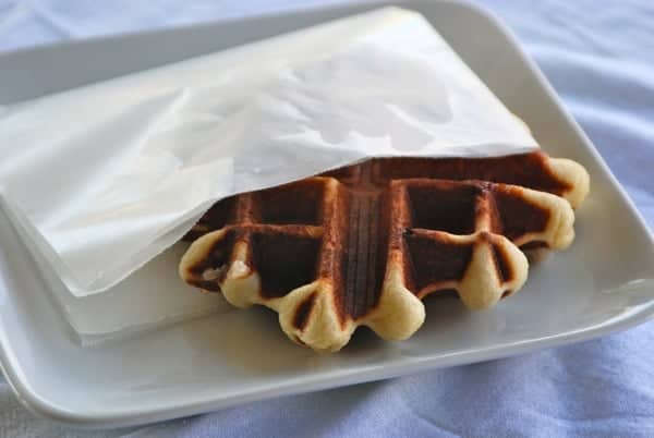 cooked waffle on a plate wrapped in paper