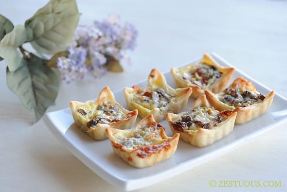 plate filled with mini quiches