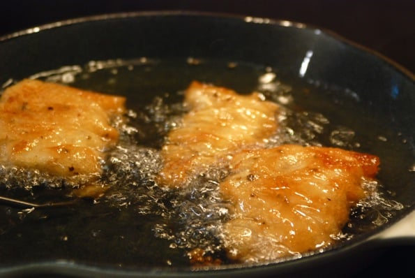 cod fish frying in oil