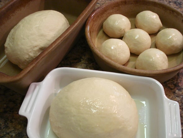 round balls of milk bread dough in pans to rise 