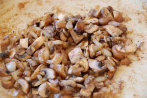mushrooms sautéed in pan.