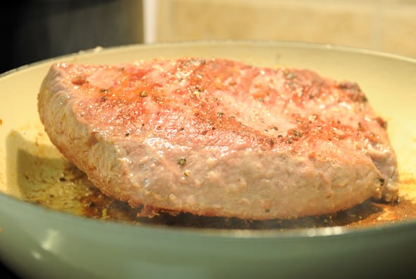 searing corned beef in a pan