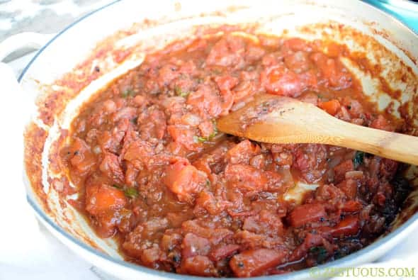 tomato sauce simmering in a pan