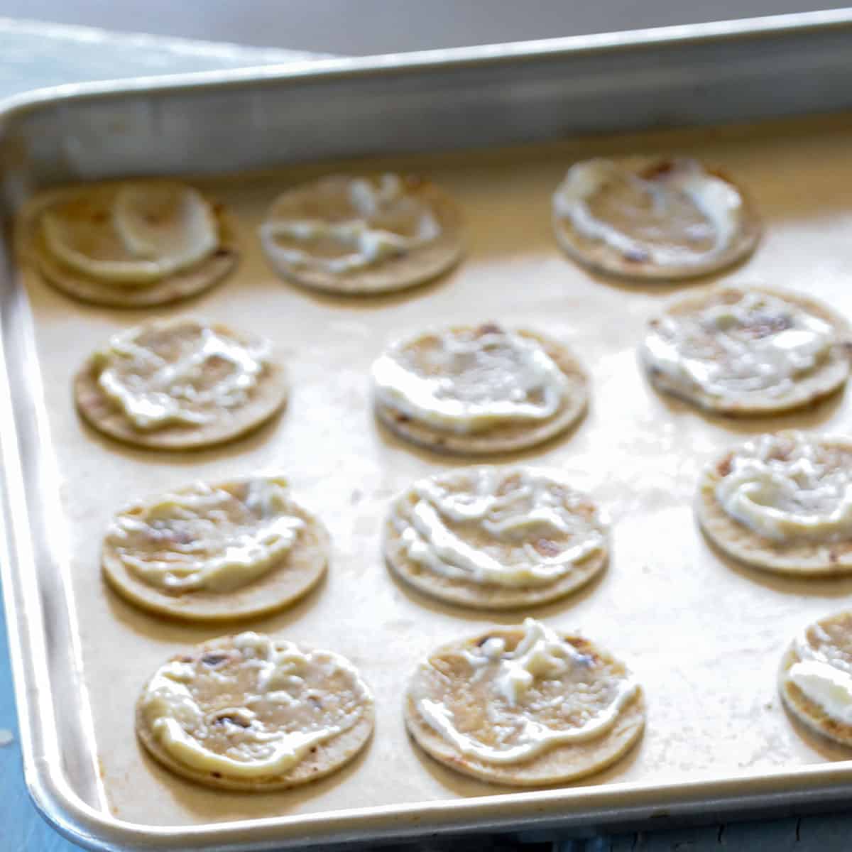 aioli on tortilla rounds. 