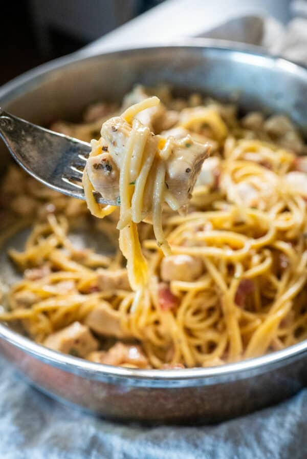 Forkful of chicken carbonara.
