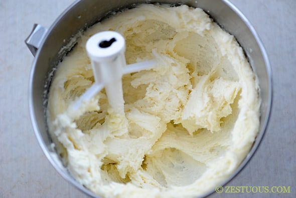 butter, sugar and cream cheese mixed together in stand mixer bowl. 