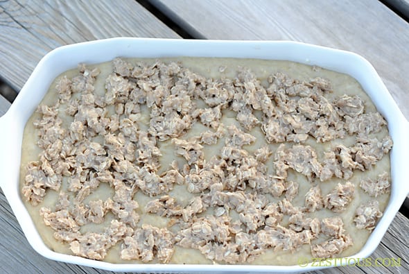 picture of baking dish with coffee cake mixture and crumble topping