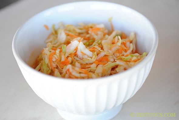 cabbage slaw in a white bowl