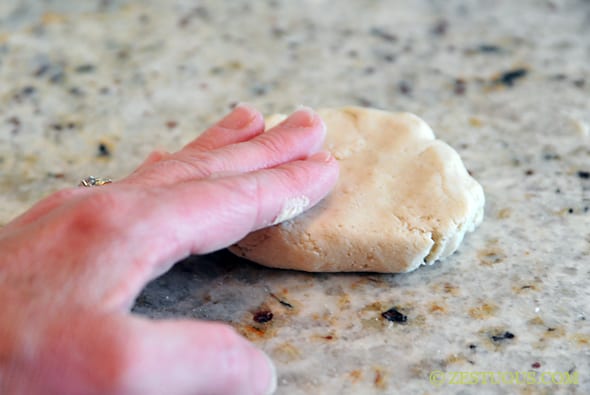 flattened pupusa dough on counter