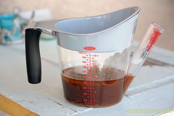 Zestuous sauce in a measuring cup