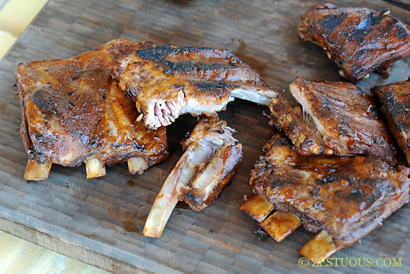 close up of ribs in a wooden cutting board