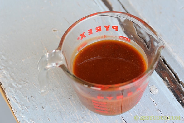 Zestuous sauce in a measuring cup