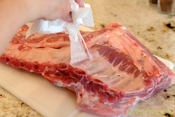 pulling fat off a rack of ribs