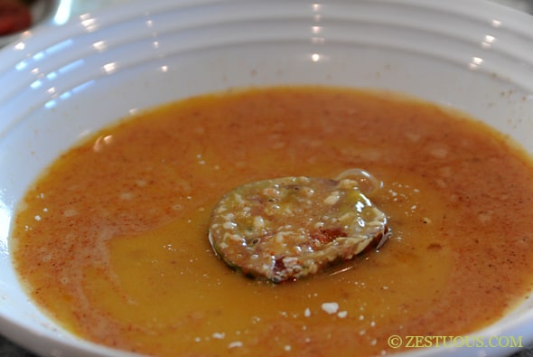 tomato slice dipped into egg mixture