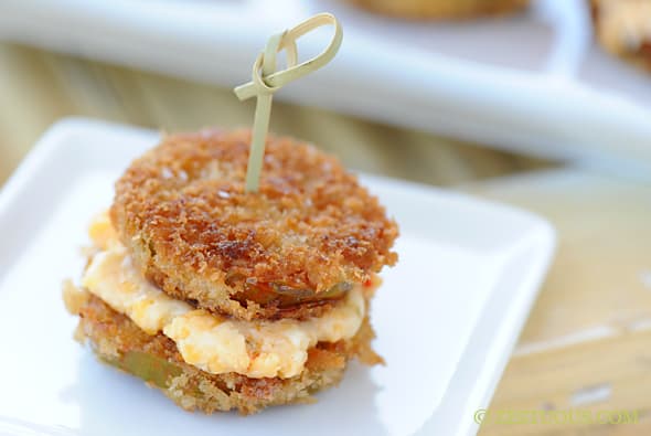 close up of a fried green tomato sandwich with pimento cheese in the middle