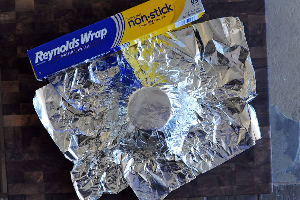 two sheets of foil pressed onto an upside down bowl.