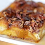 slice of Pumpkin Spice Latte Baked French Toast with Bacon Pecan Maple Syrup.
