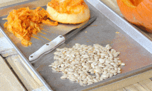 cleaned pumpkin seeds on pan.