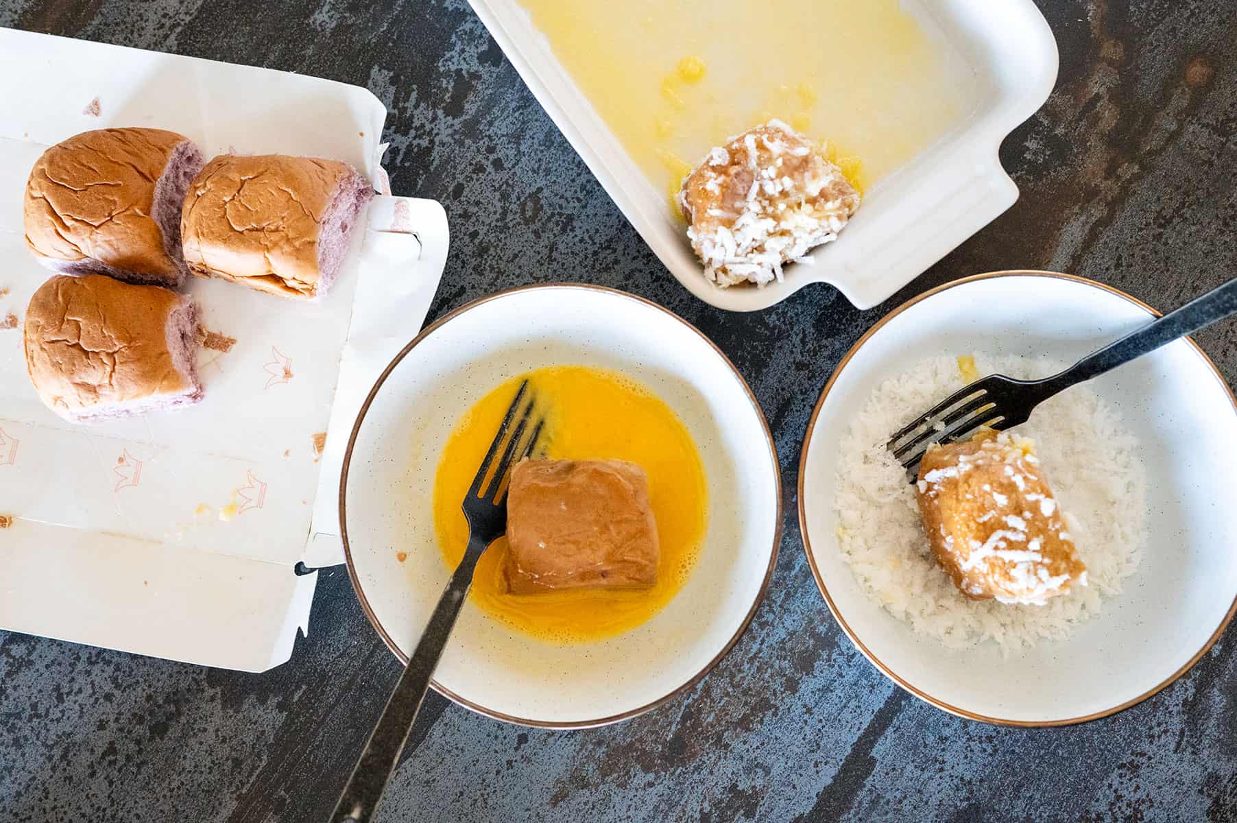 rolls coated in egg wash and coconut.